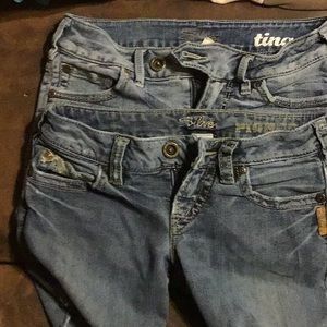 2 pair of silver shorts